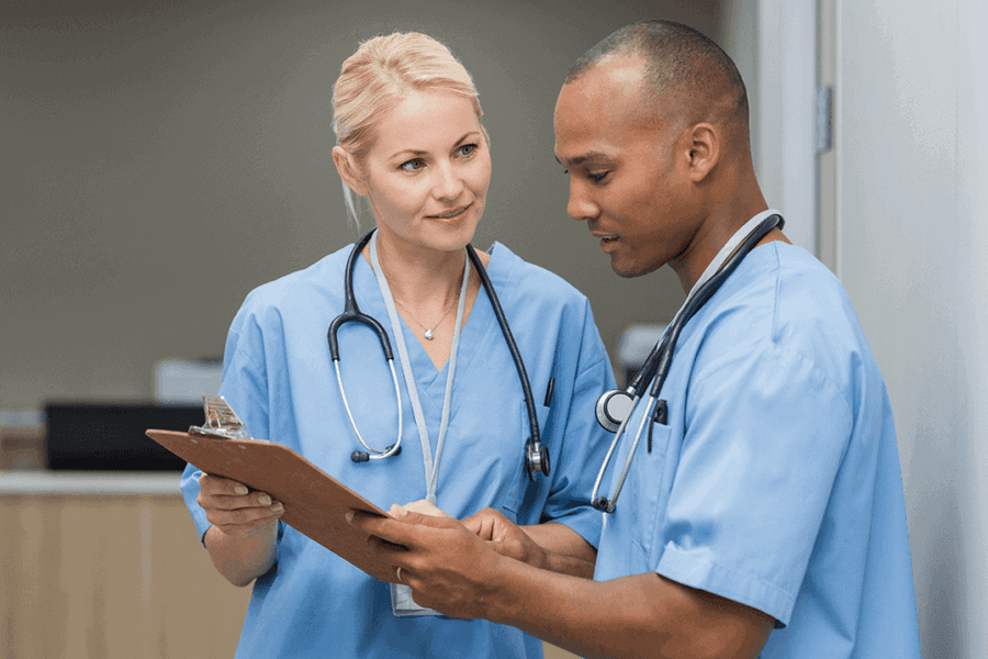 nurse practitioners looking at a chart