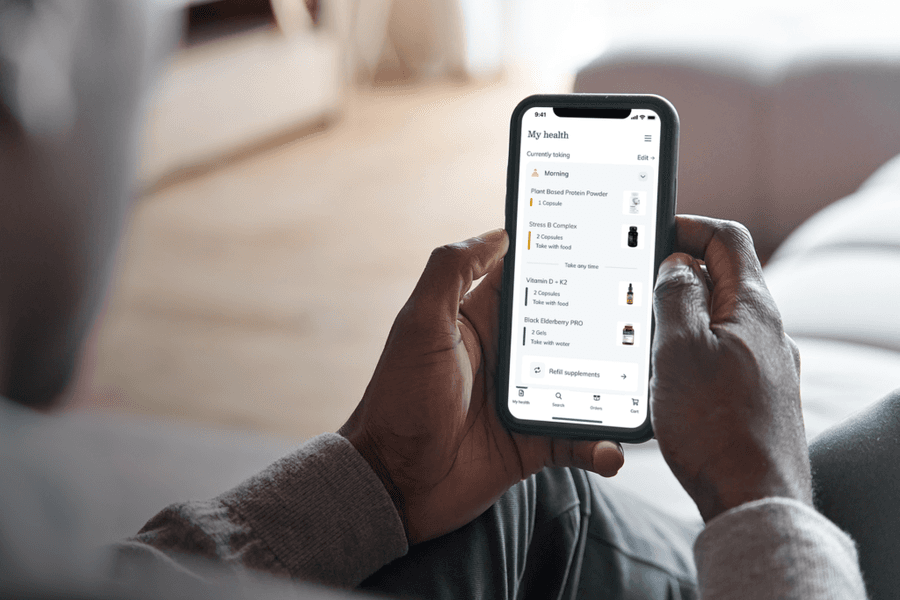 man using fullscript mobile app on his phone
