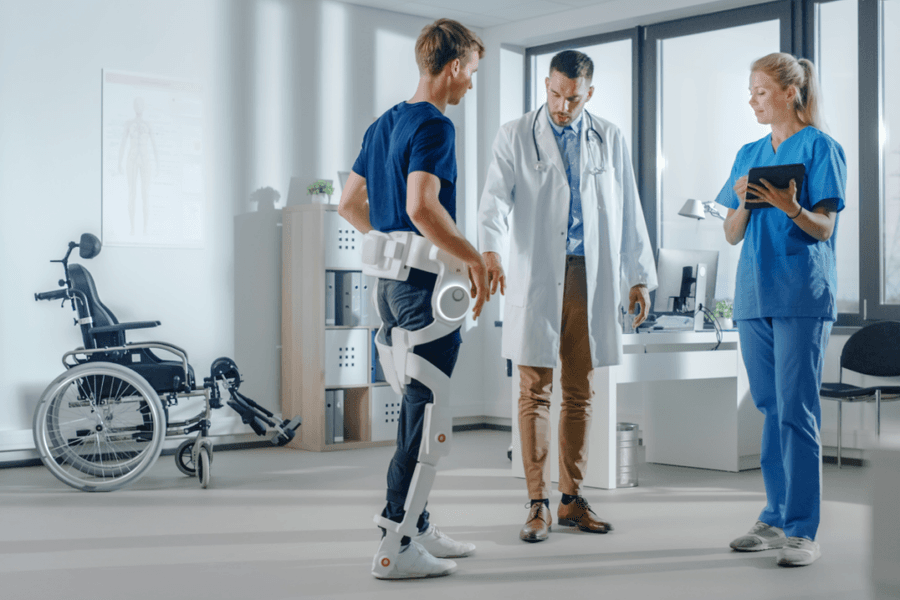 doctor using ai in healthcare to help patient walk