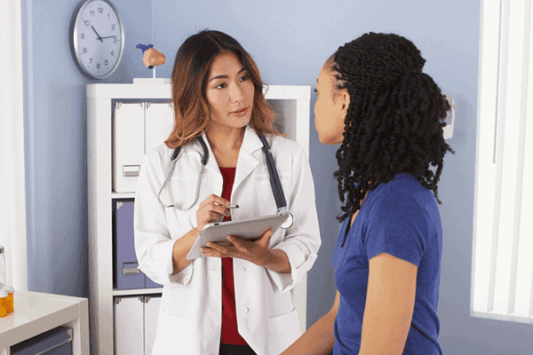 Doctor listening to a patient's concerns