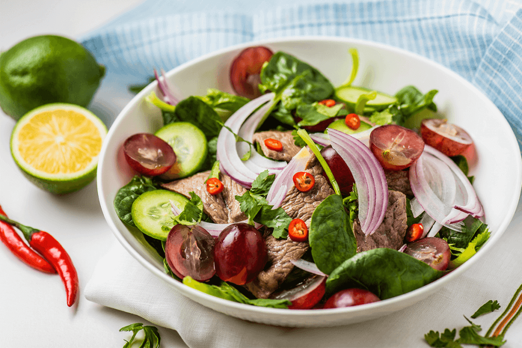 a bowl of protein and a variety of vegetables