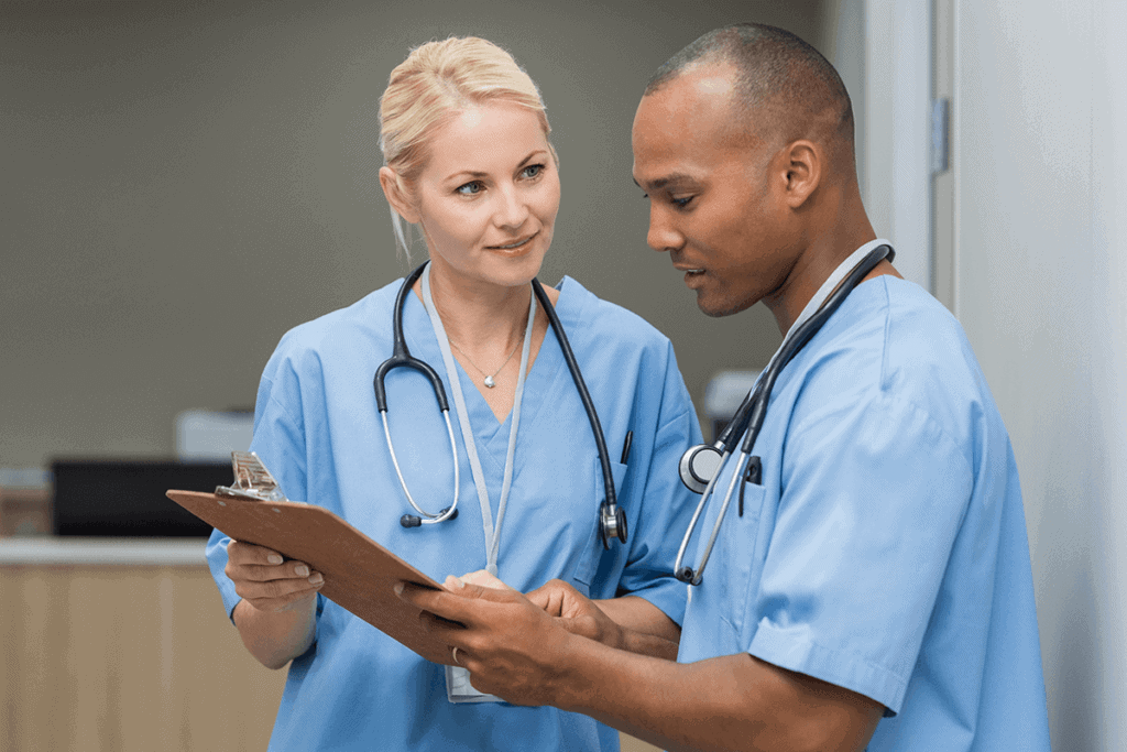 nurse practitioners looking at a chart