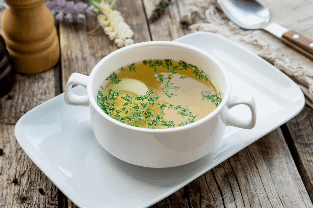 A white bowl with bone broth