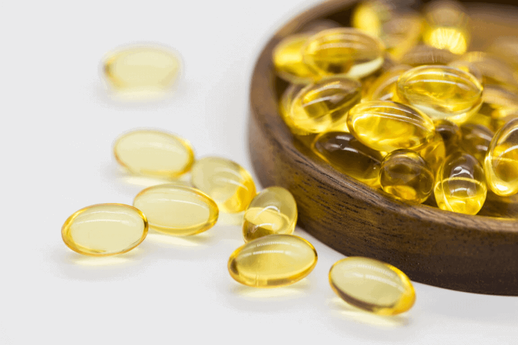 fish oil supplements in a wooden bowl