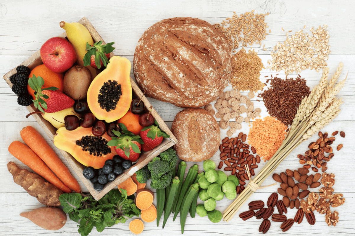 variety of foods including bread, fruit, vegetables,