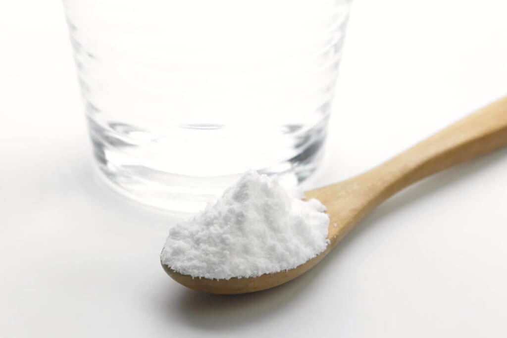 pile of flour on wooden spoon