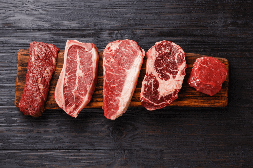 red meat cut up on a board
