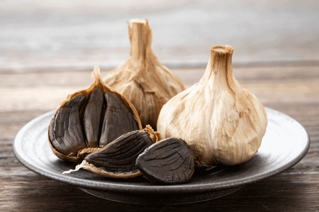 Aged garlic gloves on a white plate
