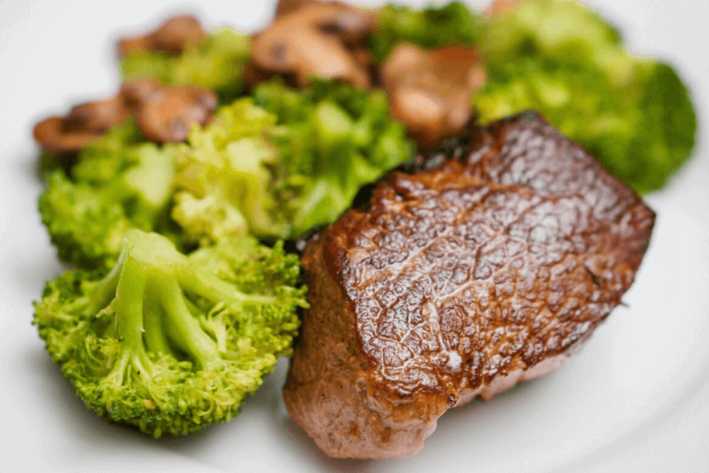 steak dish with broccoli as sides