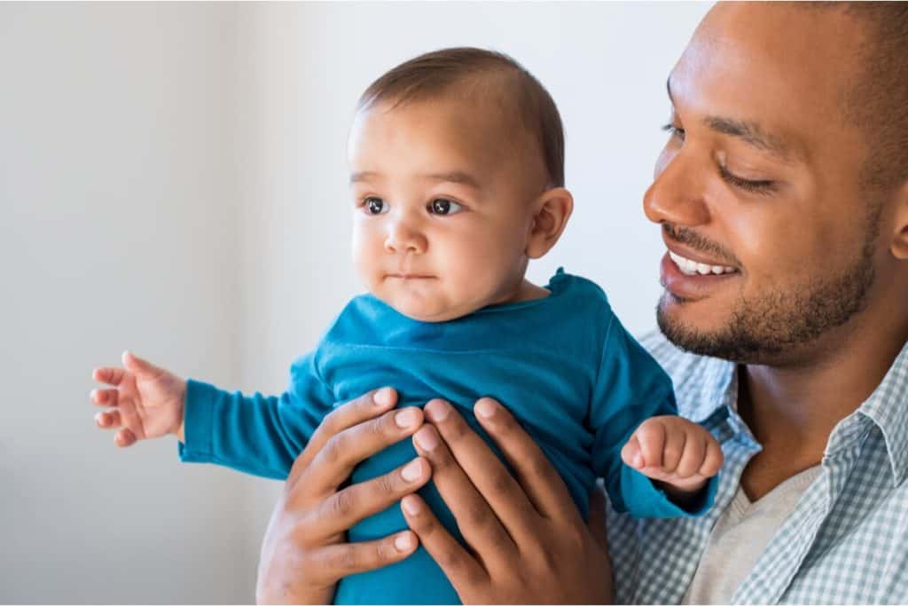 Image of man holding a baby