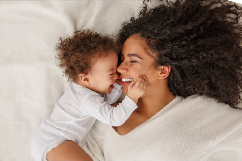 Mother lying with a baby