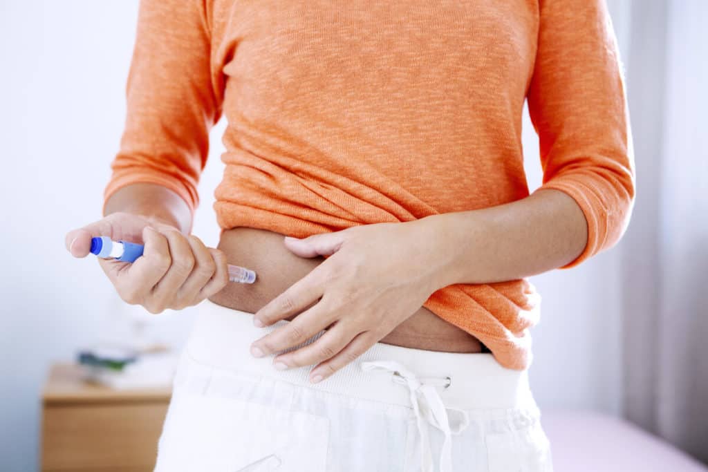 Man taking a blood glucose test