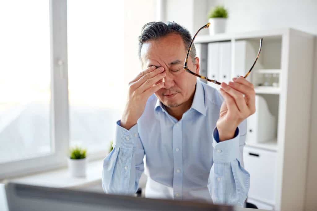 Man rubbing his eyes