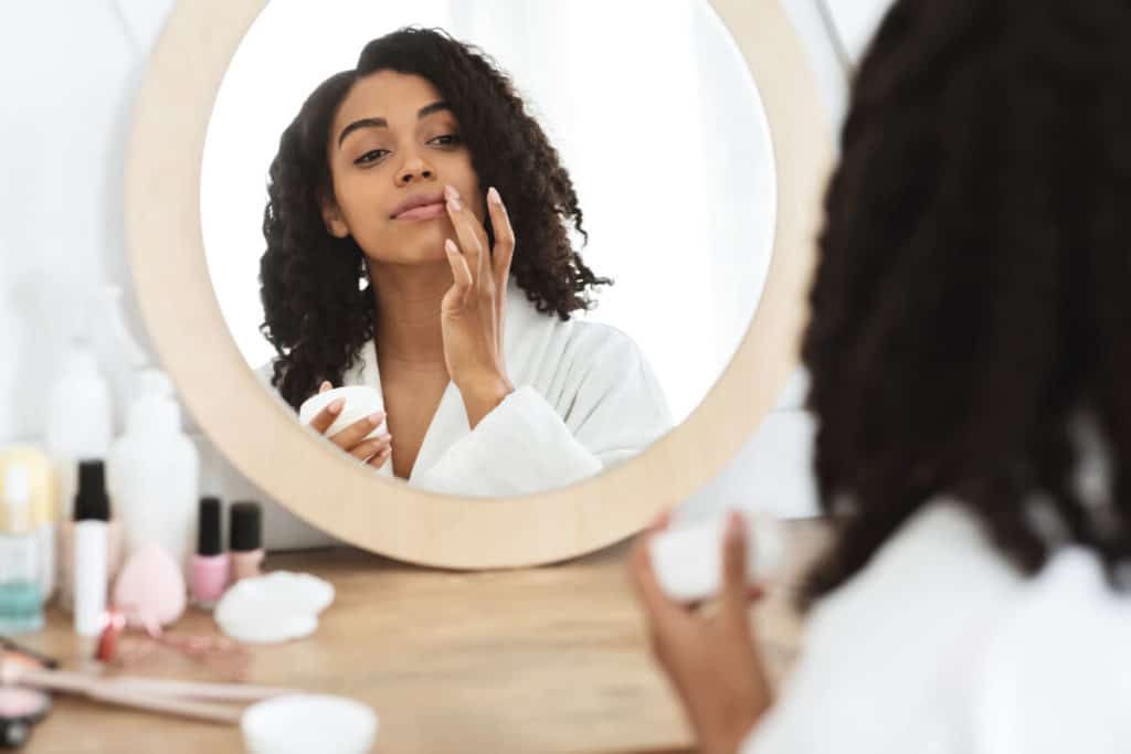 Woman looking in mirror