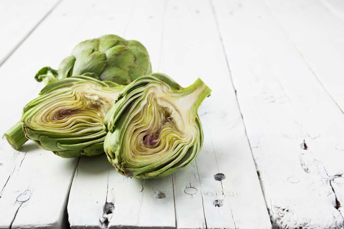 two pieces of Artichoke one cut in half