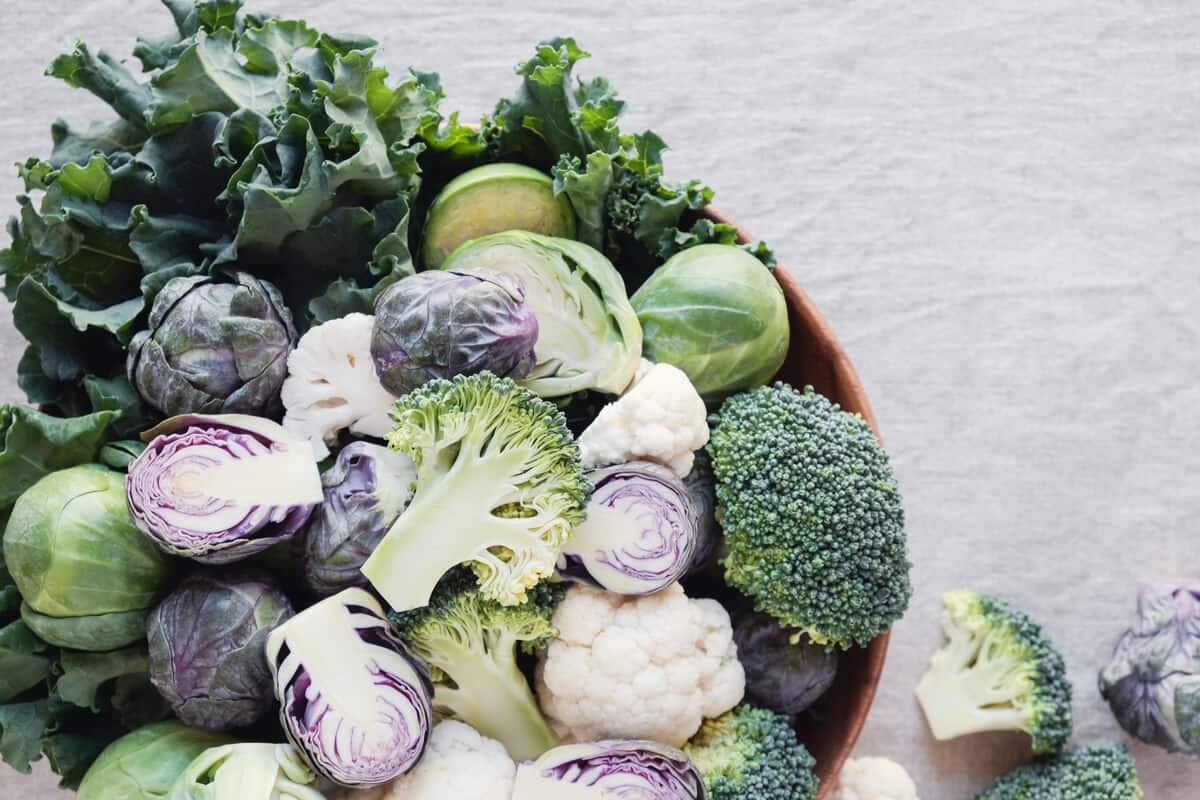 Assortment of sulfur-risch foods including broccoli, Brussels spouts, and cabbage.