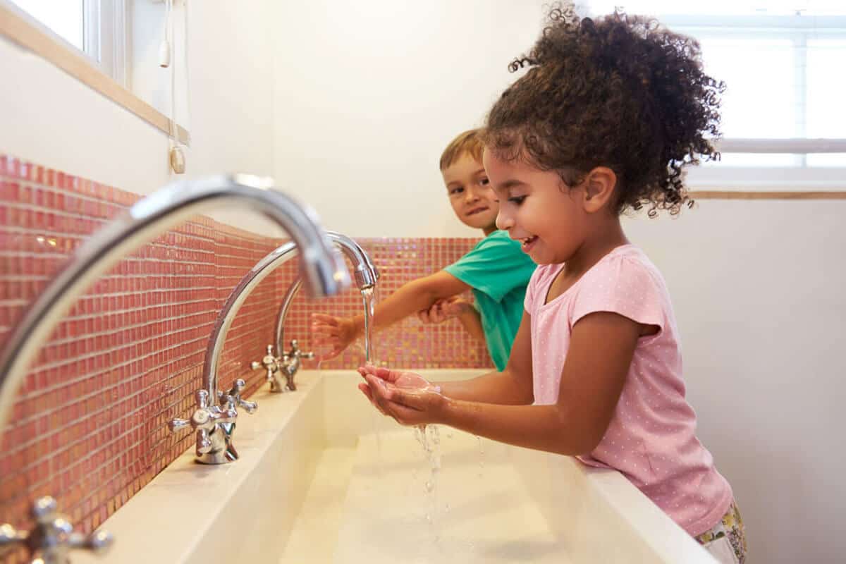 Back to school health tips child washing hands 