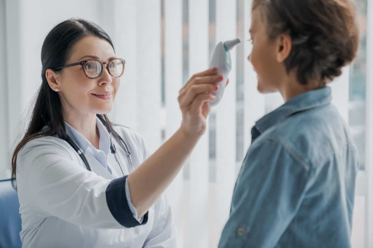 body temperature regulation practitioner taking a patients temperature
