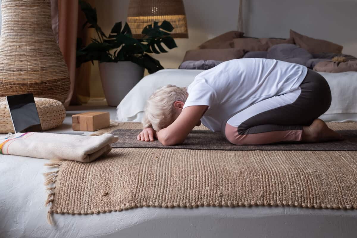 how to get rid of a headache woman stretching