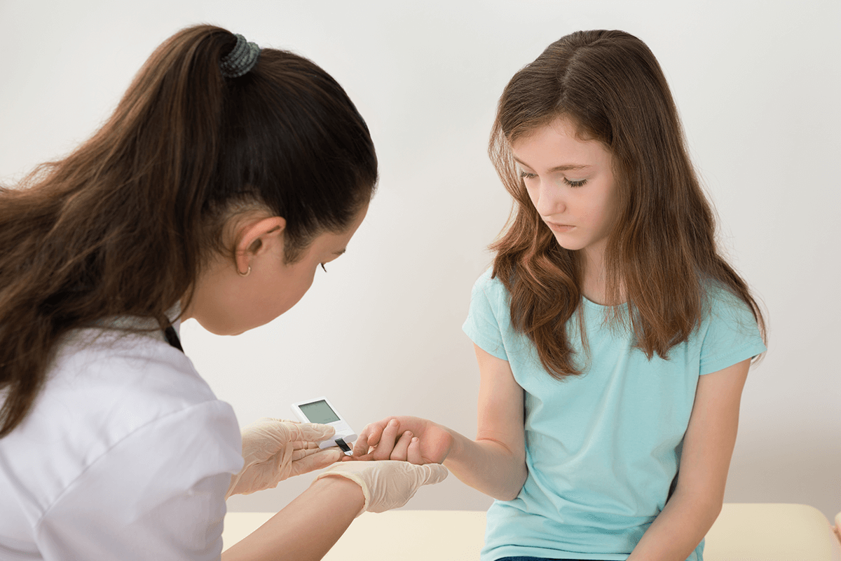 Type 2 diabetes practitioner taking blood test
