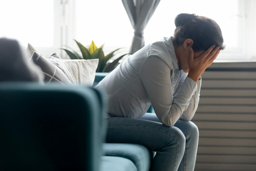 insulin resistance woman holding forehead