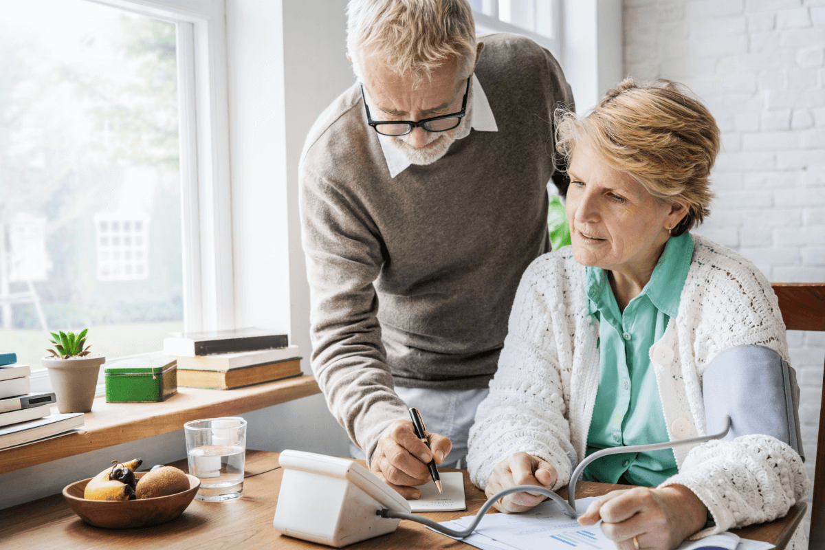 blood sugar supplements older couple measuring blood pressure