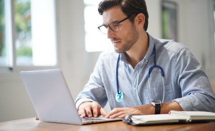 Fullscript practitioner crafting a treatment plan on laptop