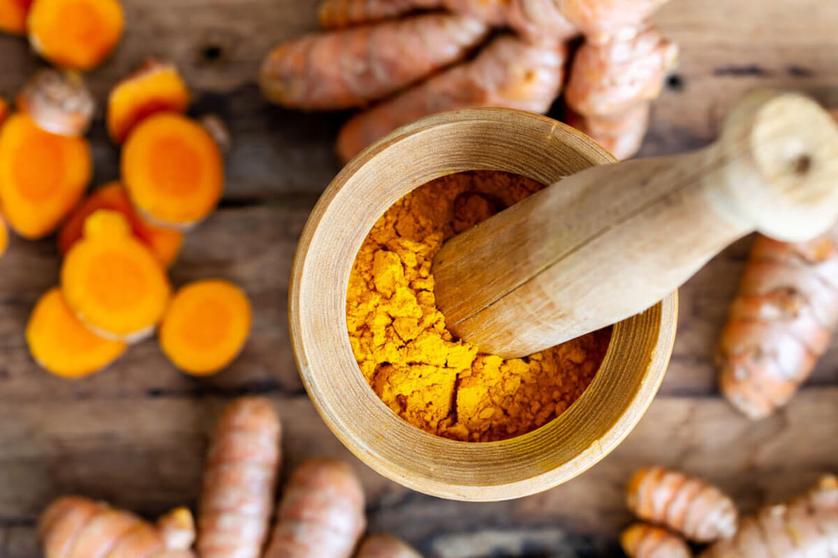 herbs to lower blood sugar ground curcumin in a bowl