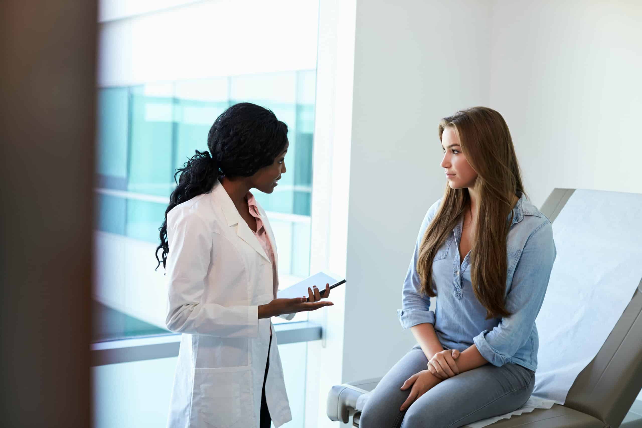 stages of puberty practitioner consulting with patient