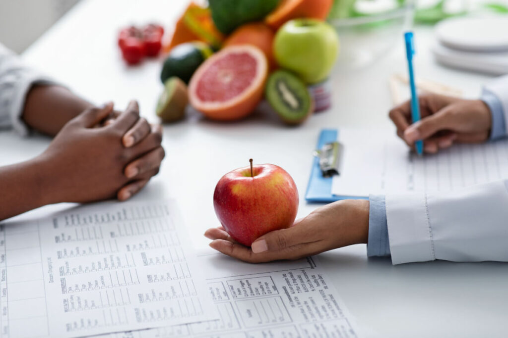 doctor holding an apple