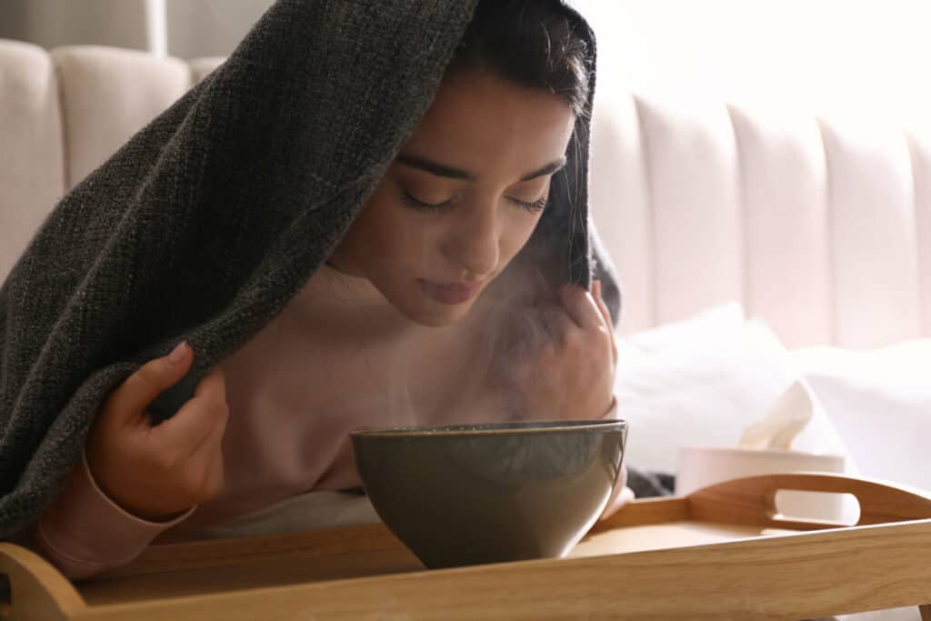 woman inhaling steam