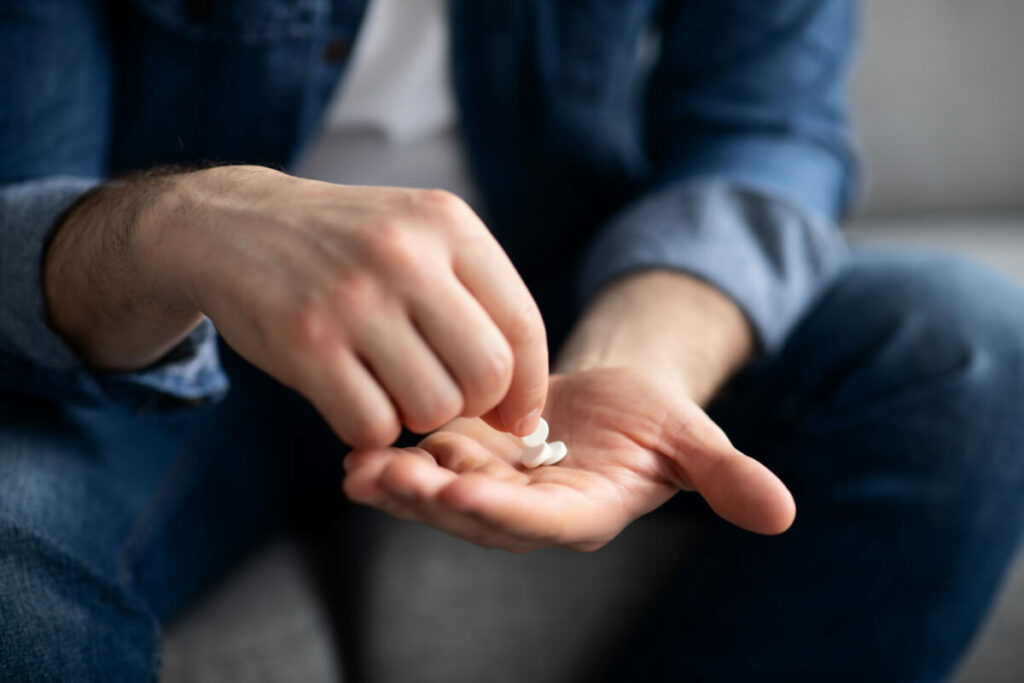 woman taking a magnesium capsule