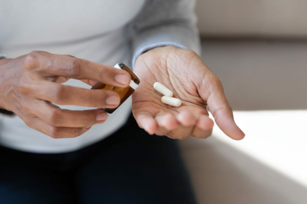 woman taking birth control pills