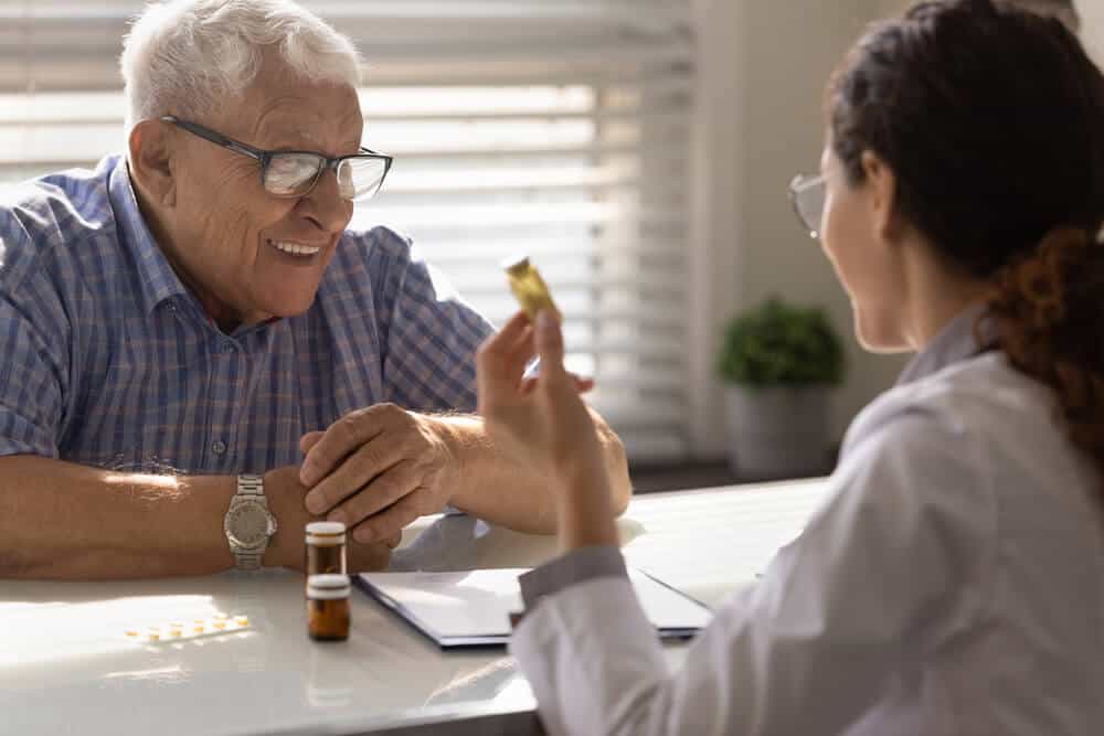 doctor providing practitioner-grade vitamins to a patient