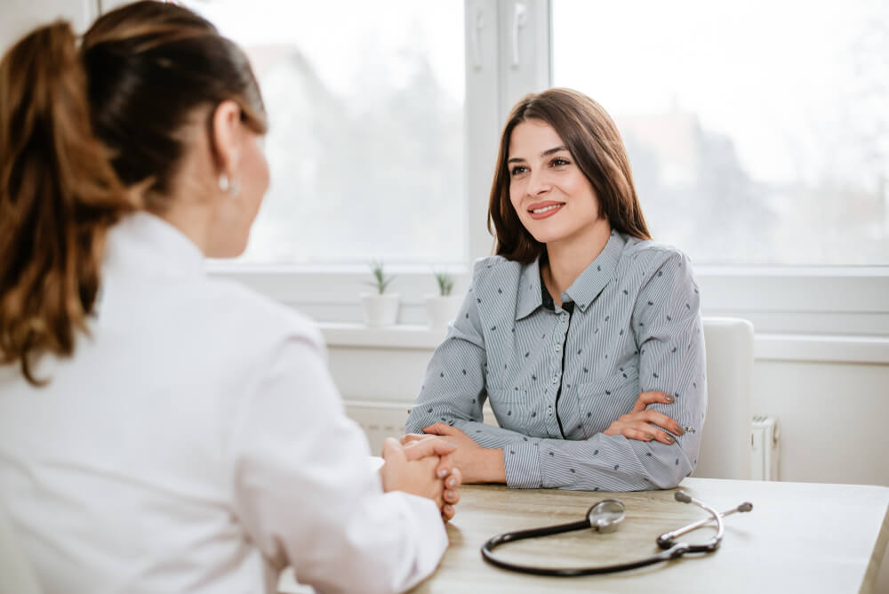 A patient talking to her doctor about supplements for a UTI.