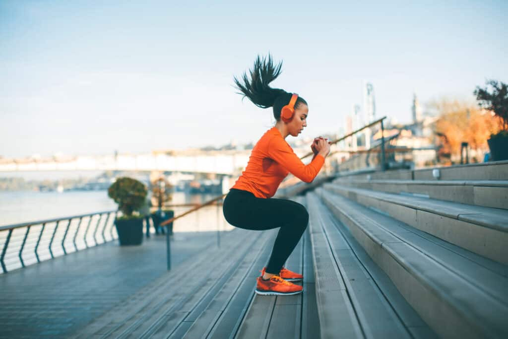woman exercising on stairs