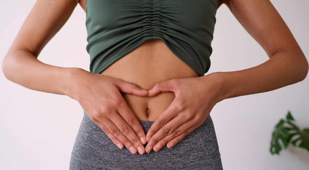 woman holding abdomen